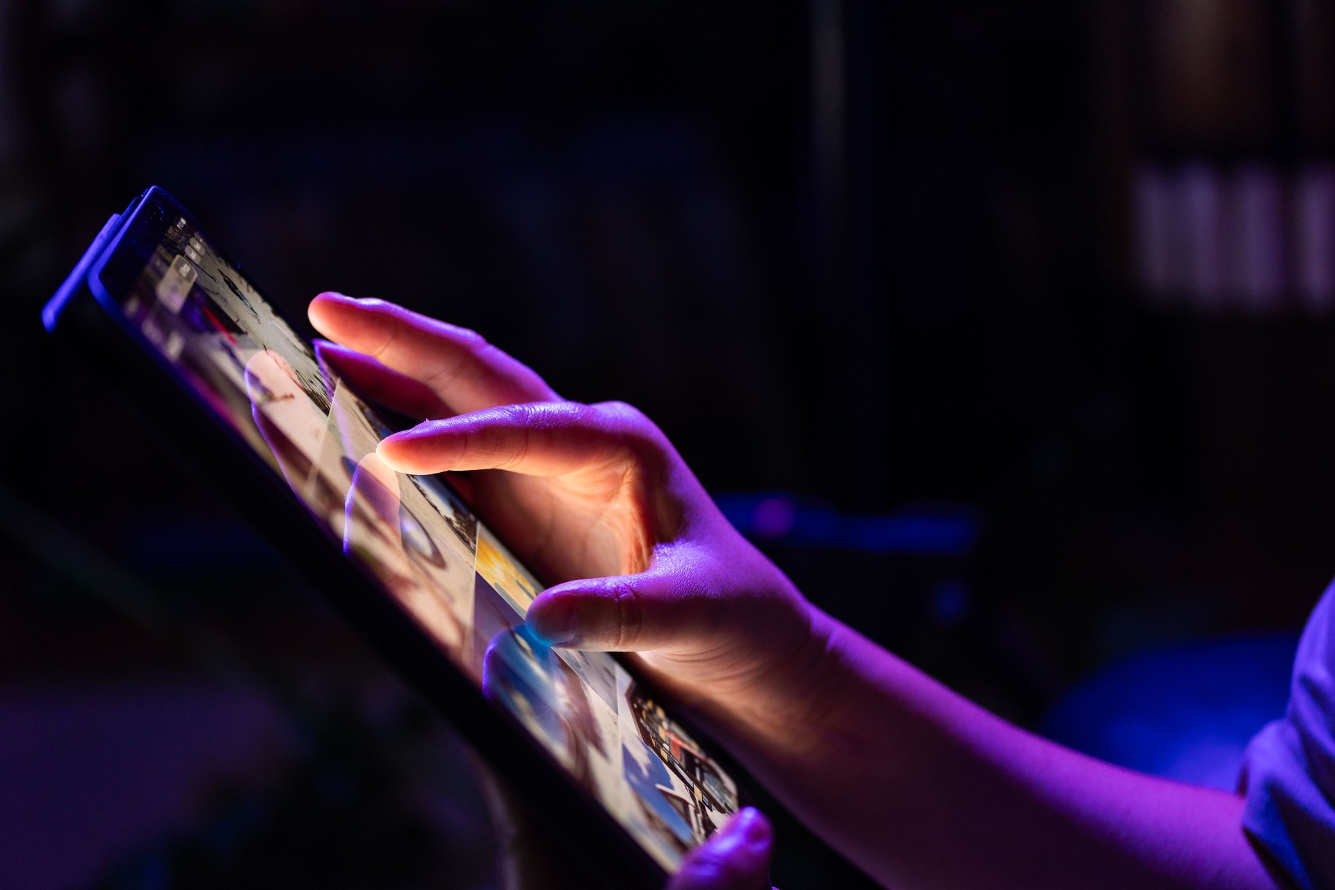 Scrolling on digital tablet at night